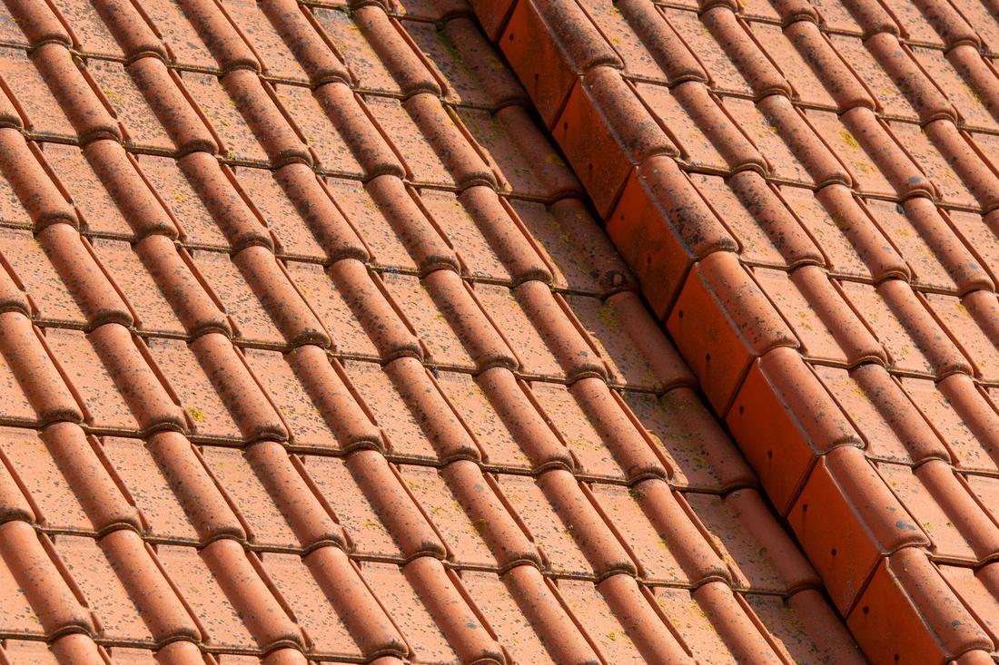 Terracotta tiles meeting at a ridge